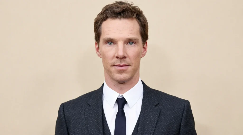 Benedict Cumberbatch in a dark suit, intense gaze, sharp features.