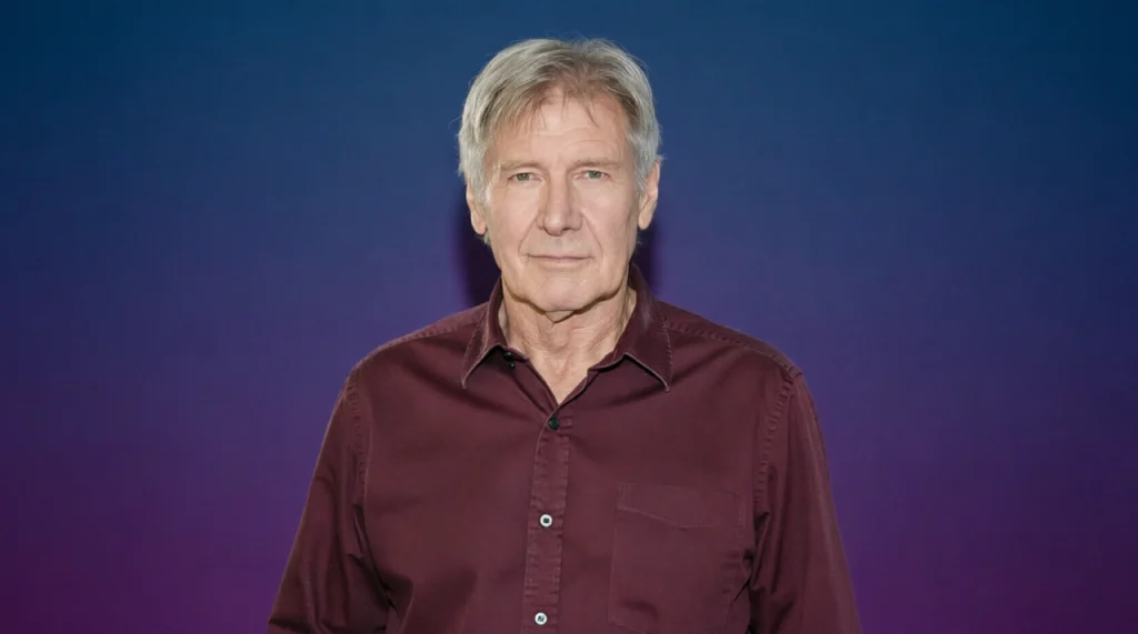 Harrison Ford in a leather jacket, slight smirk, fedora hat.