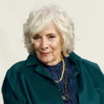 Connie Needham, the actress known for her role as Elizabeth Bradford on the TV show Eight Is Enough, portrait photo with a clean and simple background.